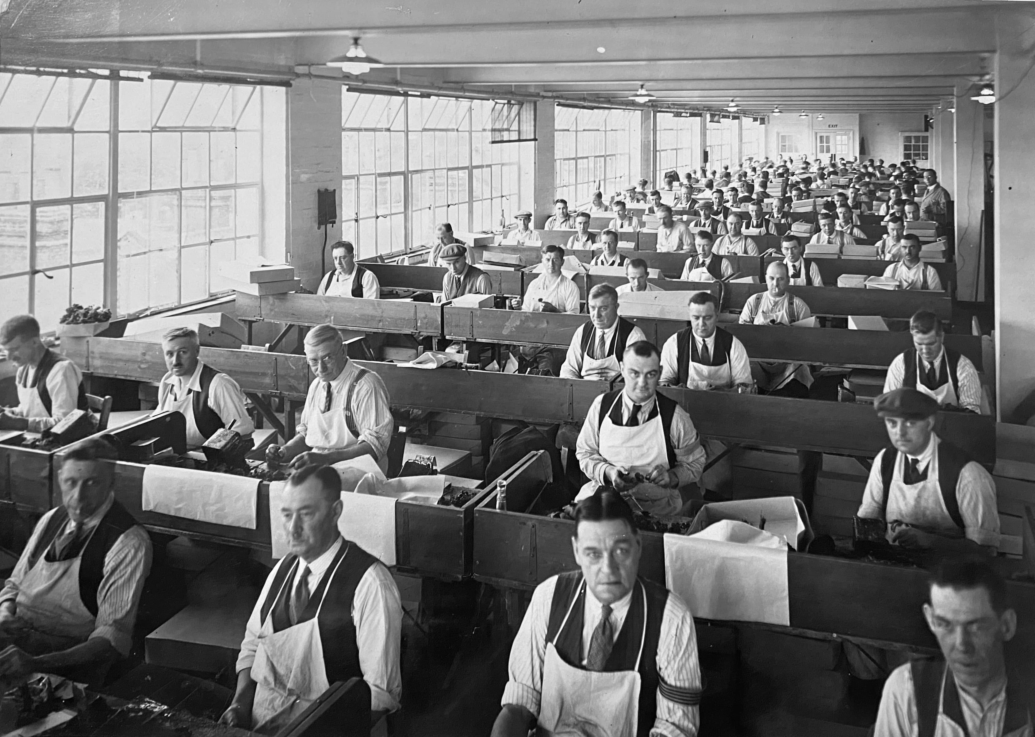 Veterans make poppies in the current factory building, c late 1930s.